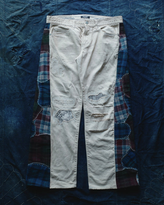 Reconstructed Number Nine tea-dyed denim jeans w/ patchwork plaid side-panel