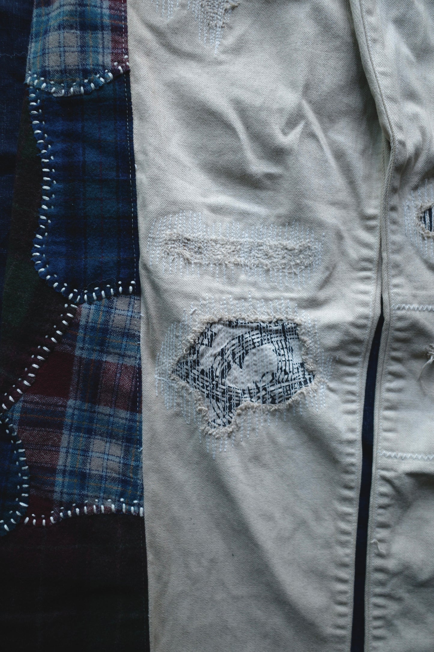 Reconstructed Number Nine tea-dyed denim jeans w/ patchwork plaid side-panel