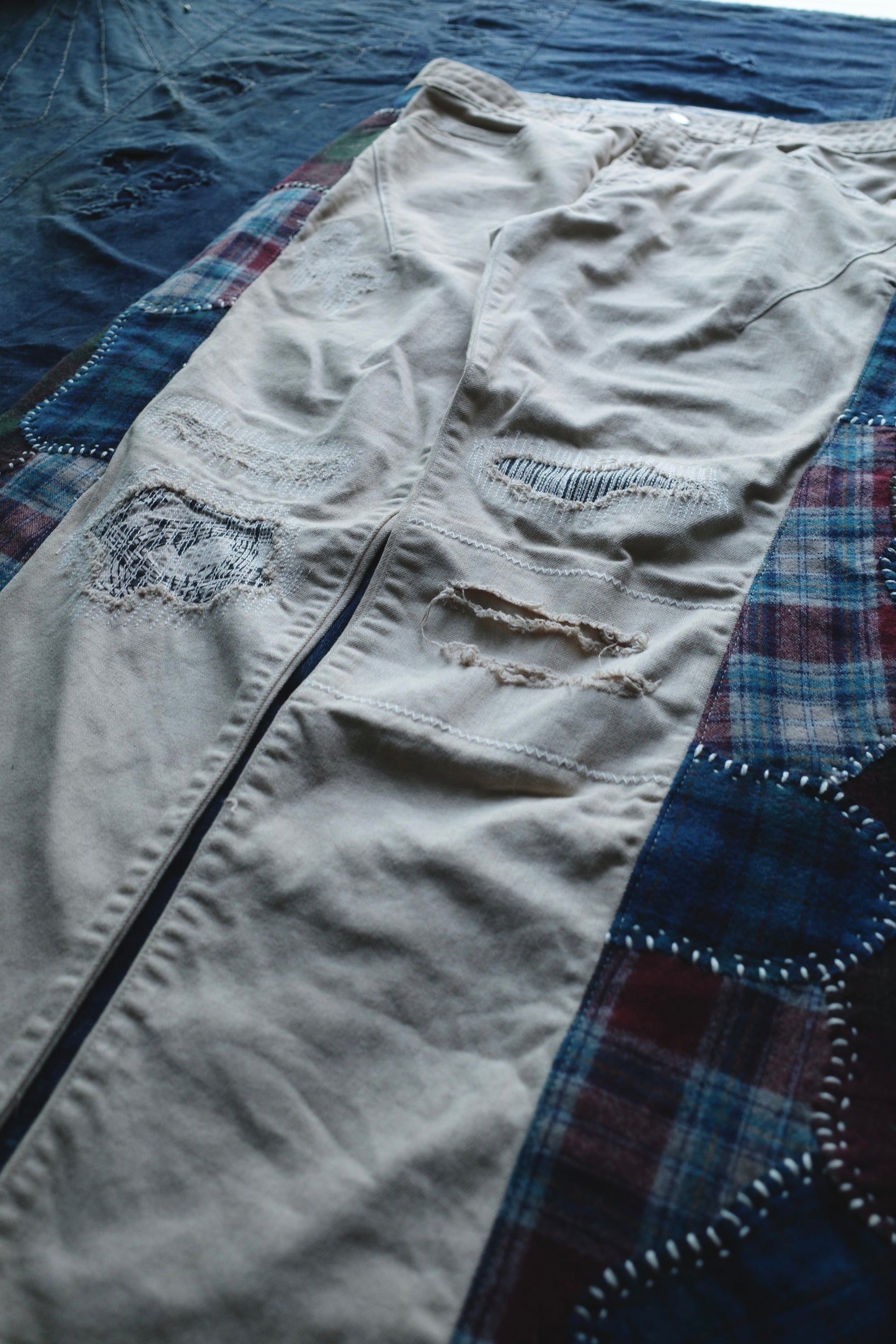 Reconstructed Number Nine tea-dyed denim jeans w/ patchwork plaid side-panel