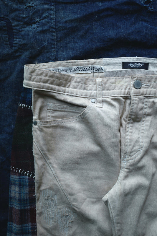 Reconstructed Number Nine tea-dyed denim jeans w/ patchwork plaid side-panel